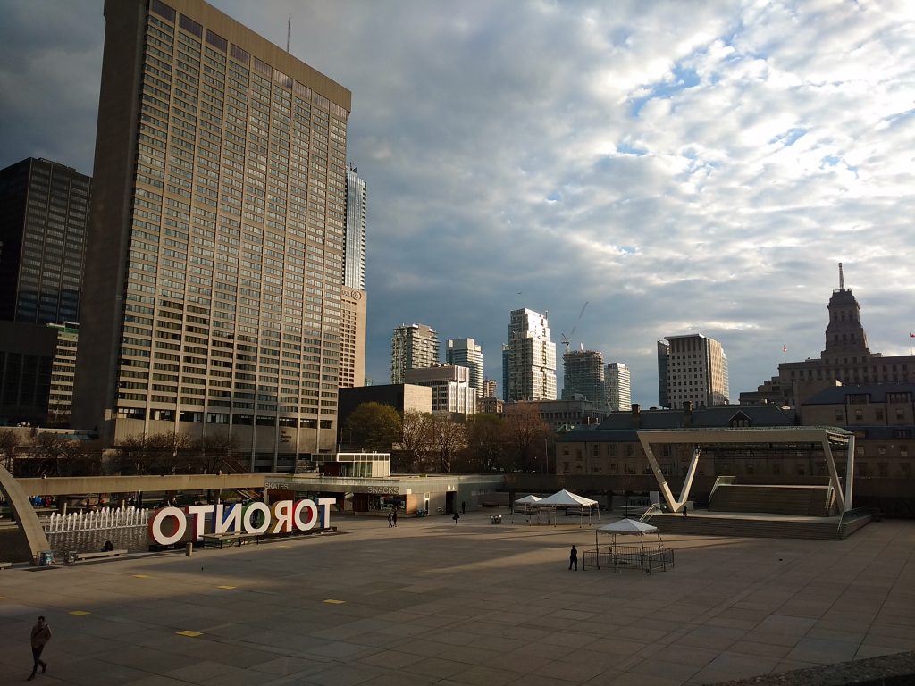 Nathan Phillips Square seen from the City Hall green roof near sunset