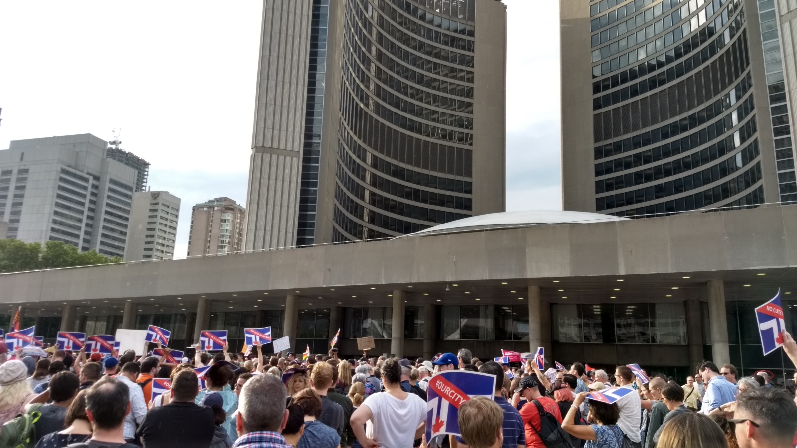 In front of Toronto City Hall, a crowd protests Doug Ford's decision to cut City Council in half.