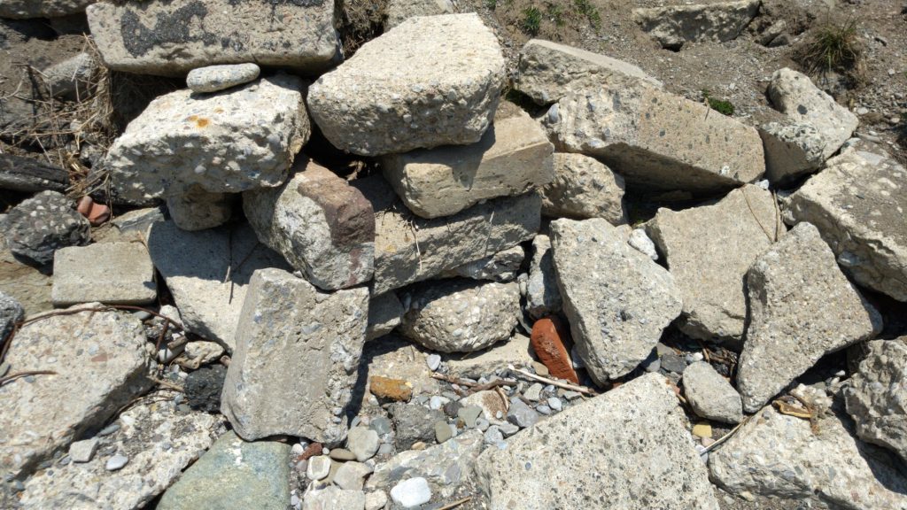 A pile of large rocks and bricks