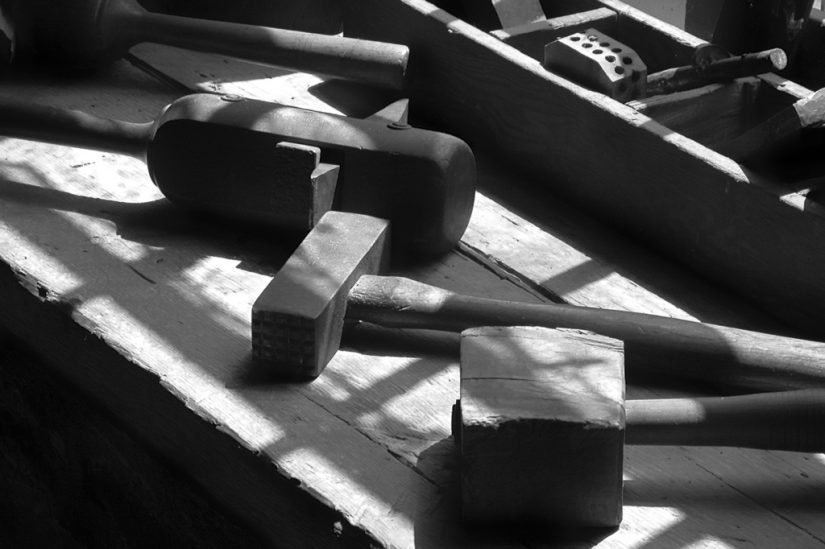 Black-and-white photo of old cooper's tools.