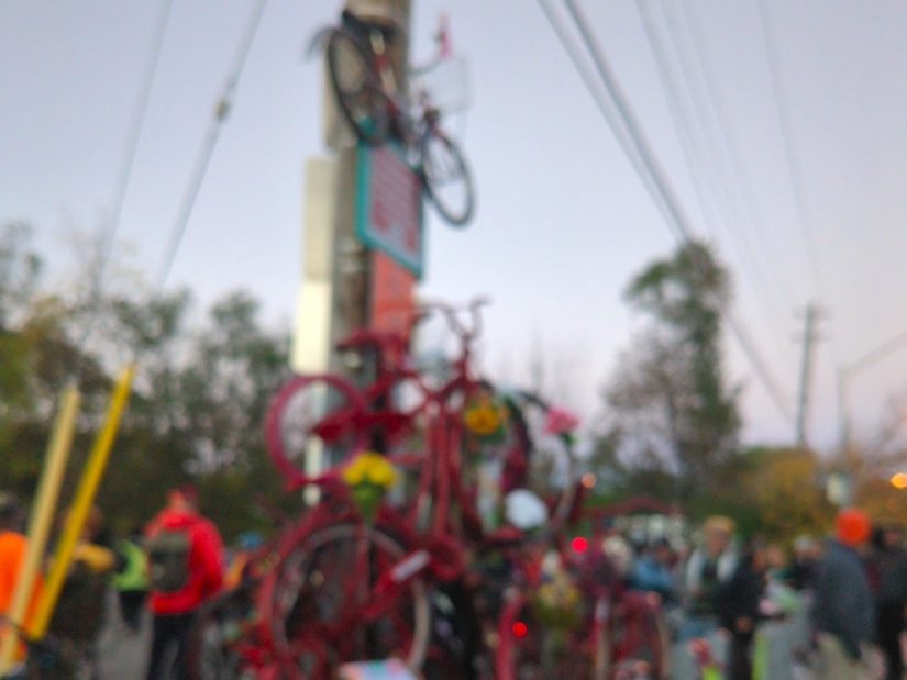 A monument made of a pile of red-painted bicycles, representing cyclist deaths and injuries on Toronto streets. Blurred for privacy.