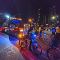 Bike police clear a way for one of the trucks hauling equipment to unload.