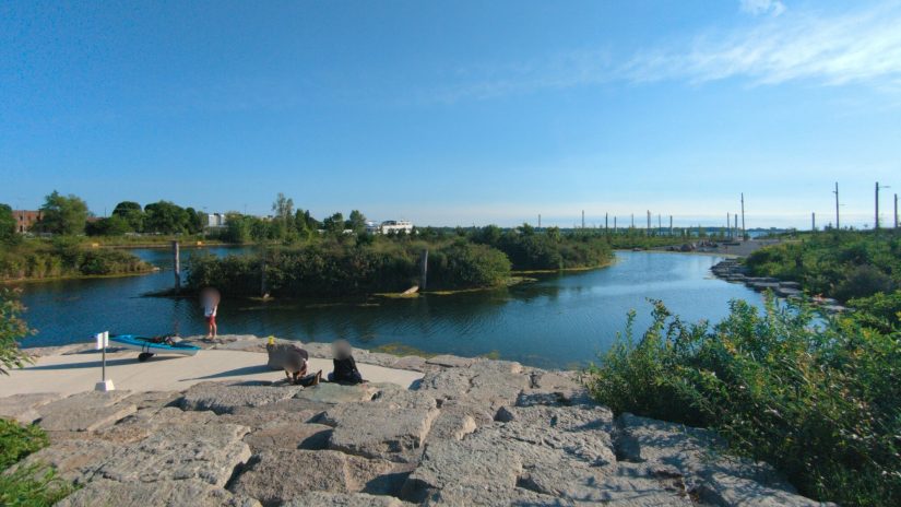 A few parkgoers look out over the then-newly opened western part of Biidaasige Park.